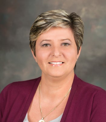 Portrait of Lizzy Byrne, REALTOR®.