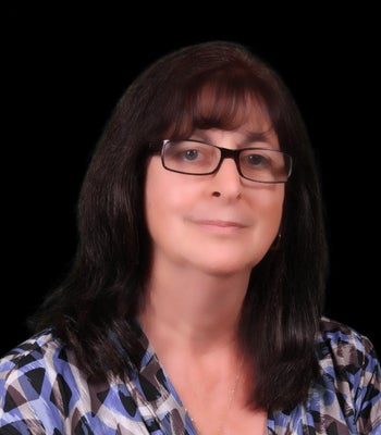 Portrait of Susan Flores, REALTOR®.